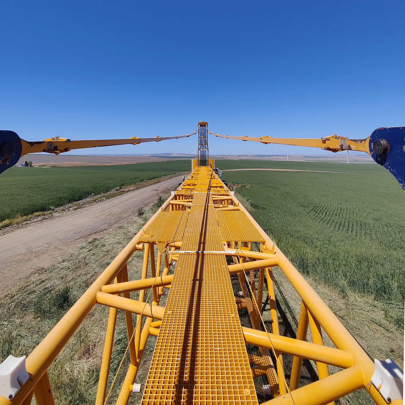 View along the top of a yellow crane boom used for operator and rigging inspection training.