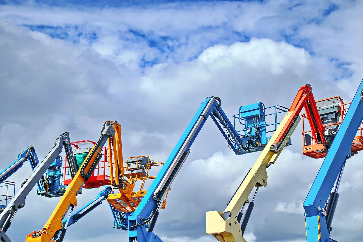 Multiple boom lifts and scissor lifts used for MEWP operator safety training and certification.