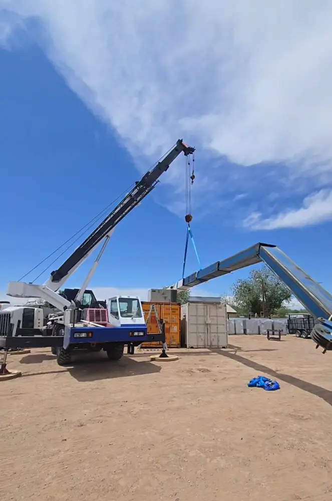 Mobile crane performing controlled lift recovery operation during safety inspection and accident analysis training.