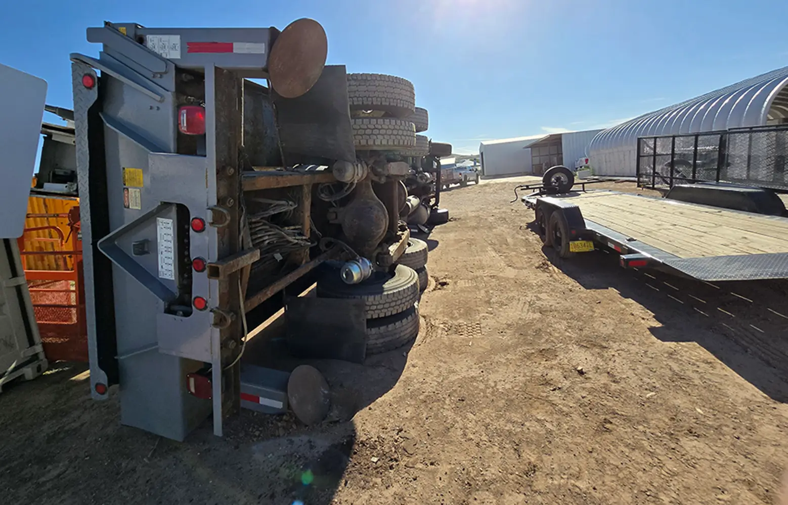 Overturned heavy equipment on construction site used for crane accident recovery and safety investigation training.