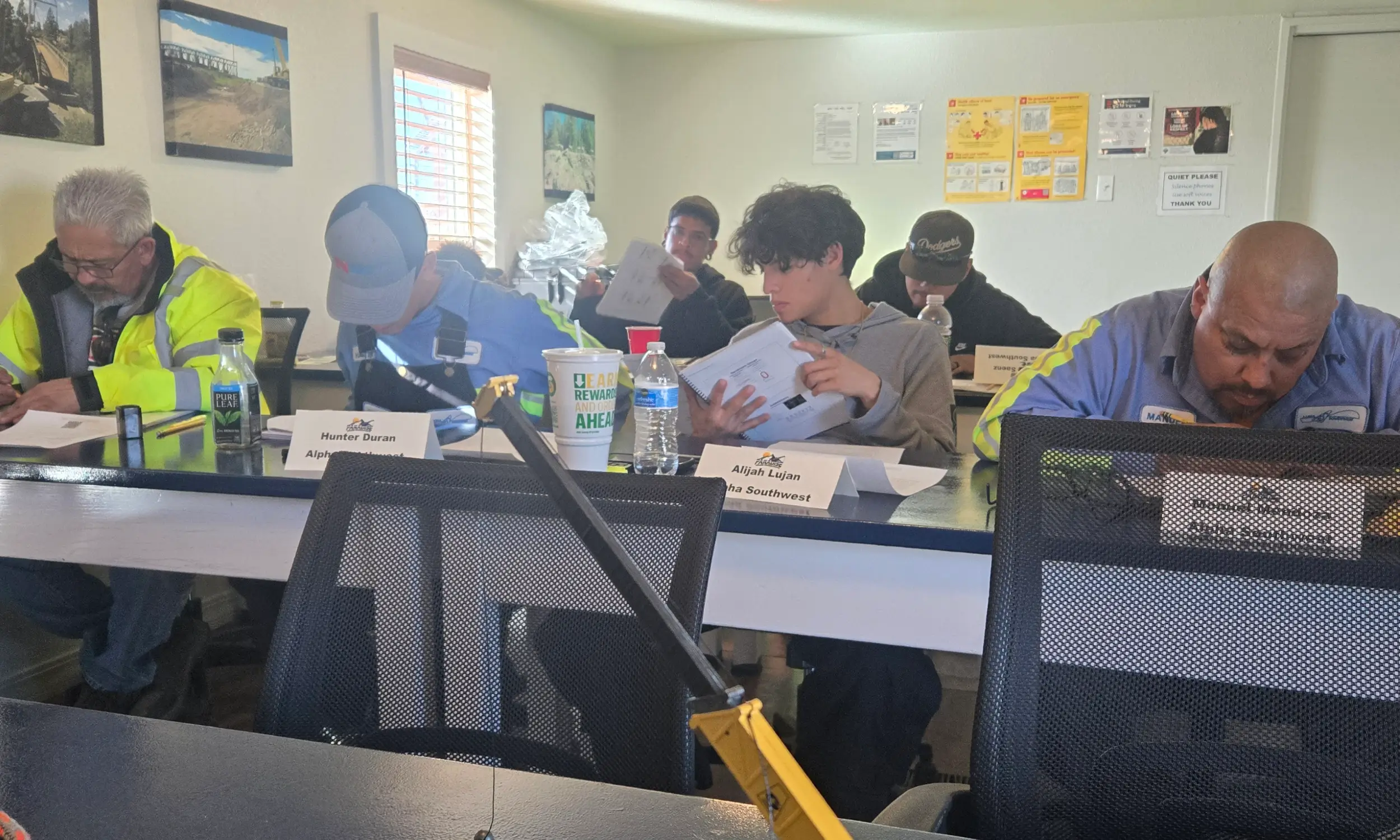 Paradise Crane on-site crane operator training class with students reviewing course materials during classroom instruction