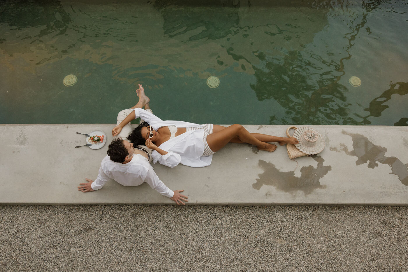 A married couple by the pool