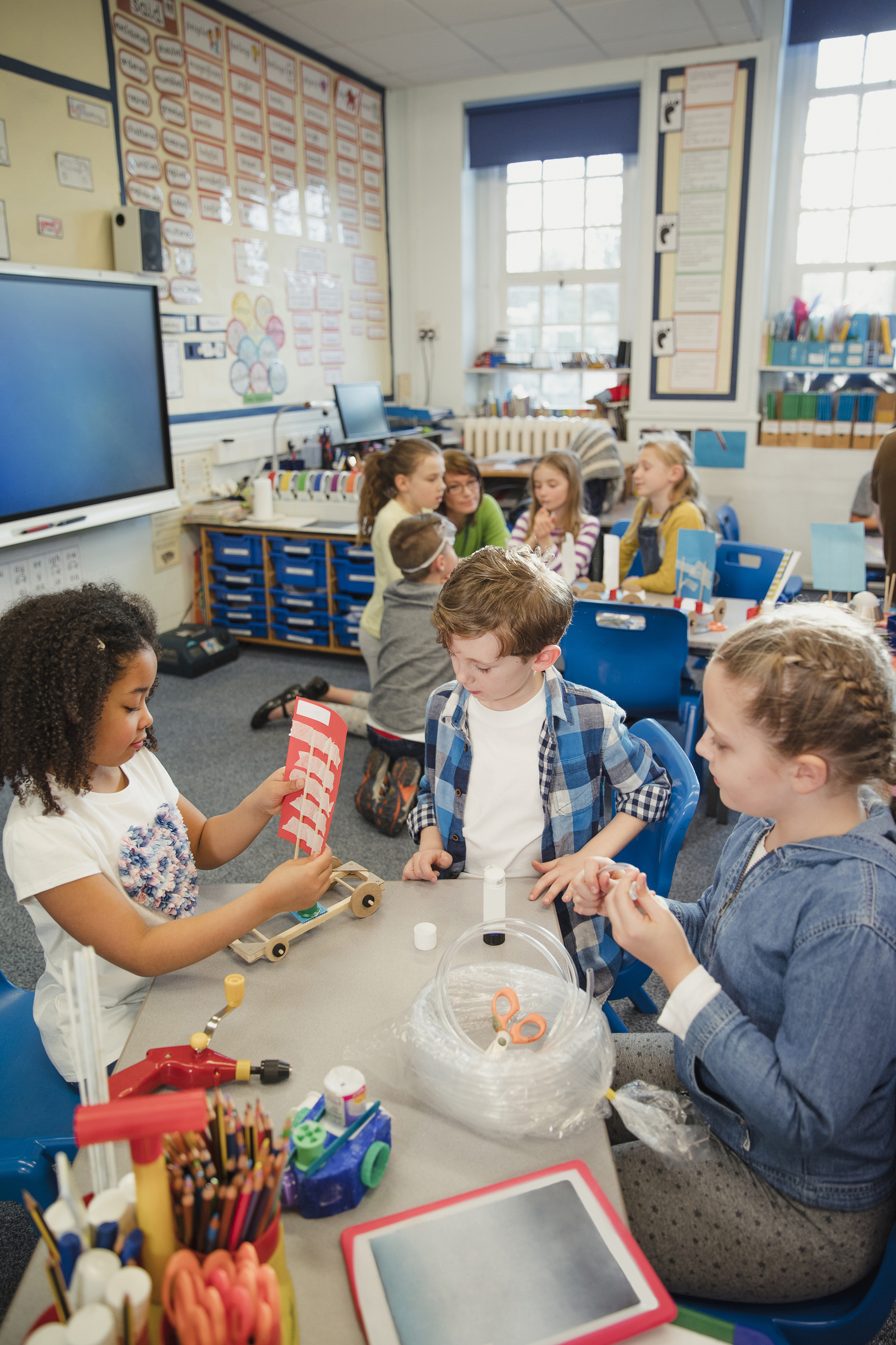 A group of elementary students engaged in learning in a classroom.
