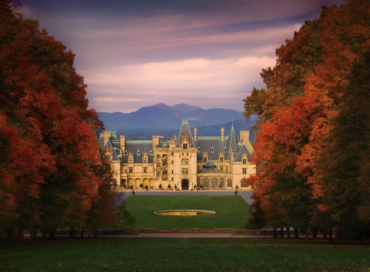 Biltmore Estate framed by autumn trees