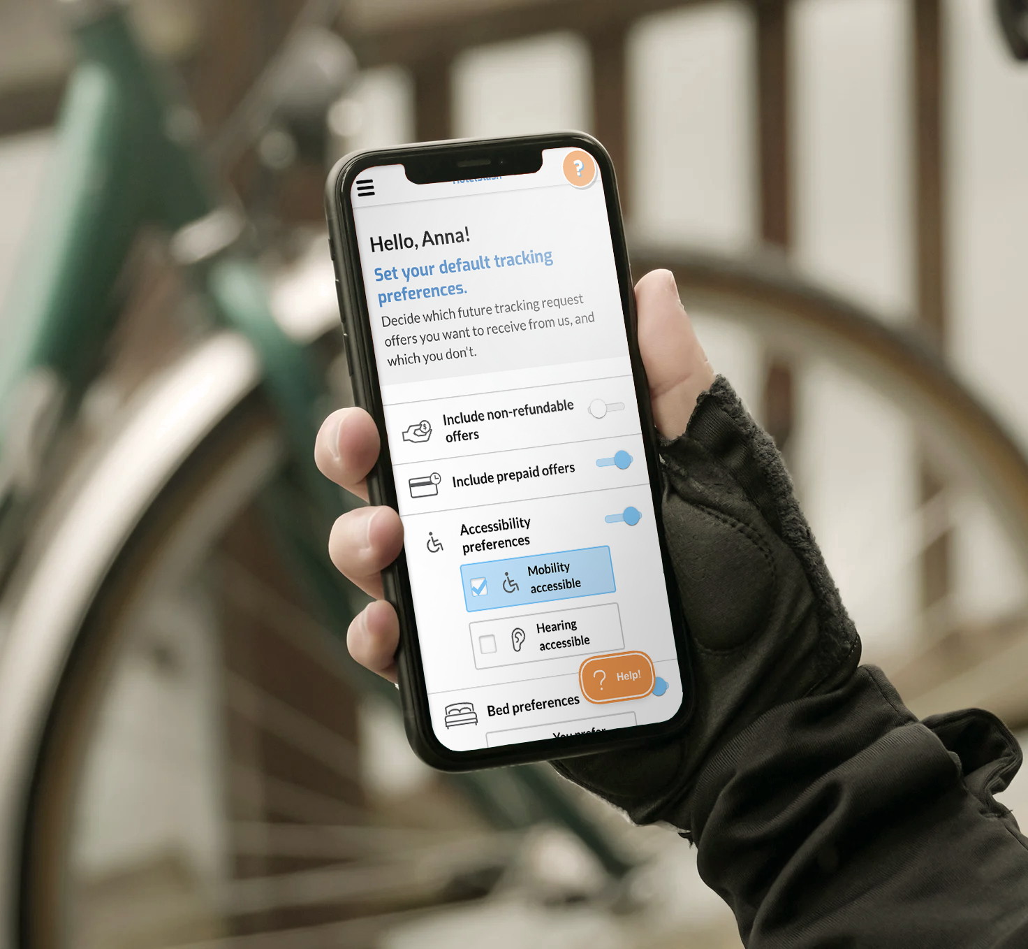 A mobile touchscreen phone displaying the user settings screen for HotelSlash, held by a gloved hand