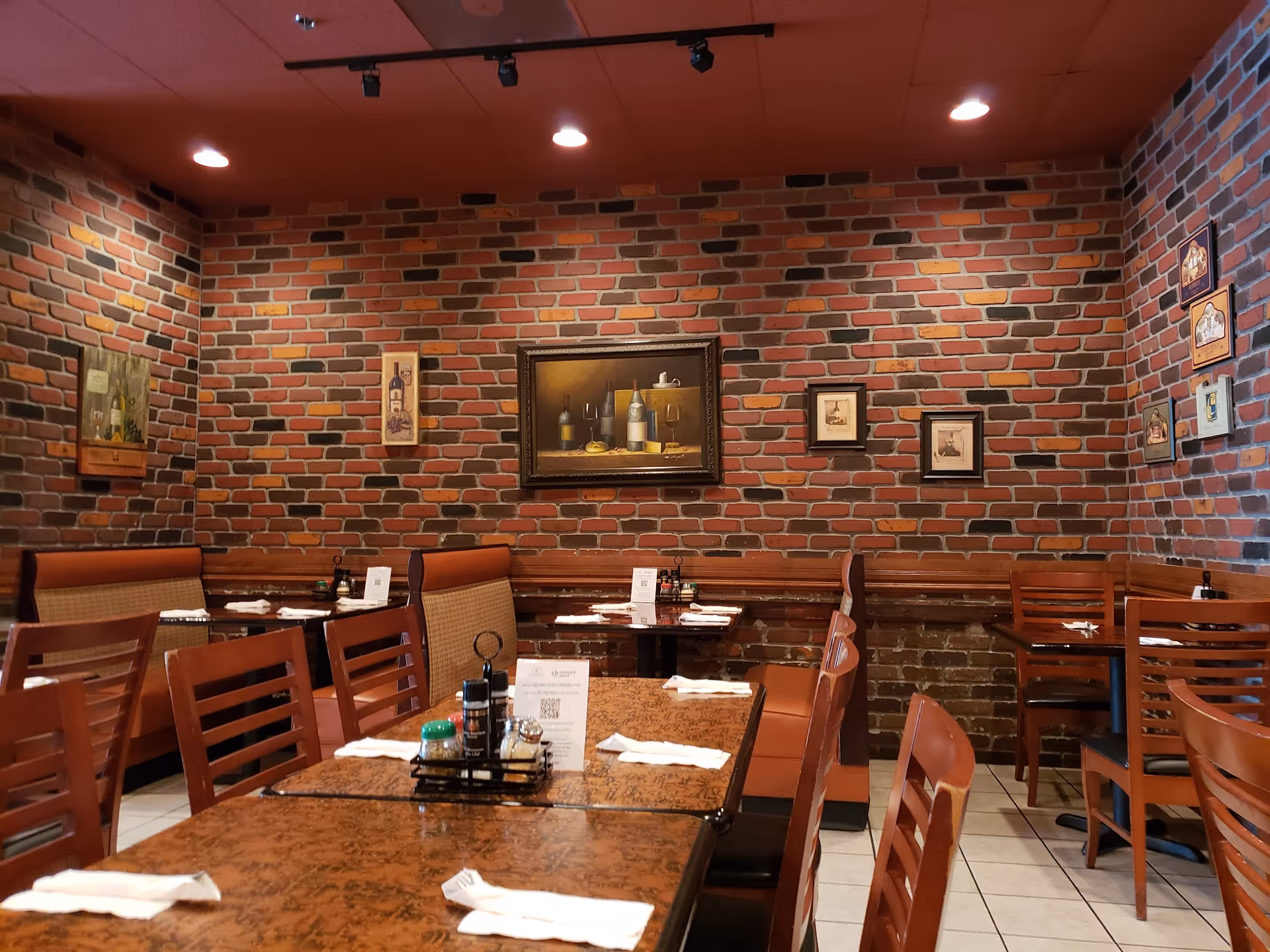 the interior of a restaurant with chairs and tables