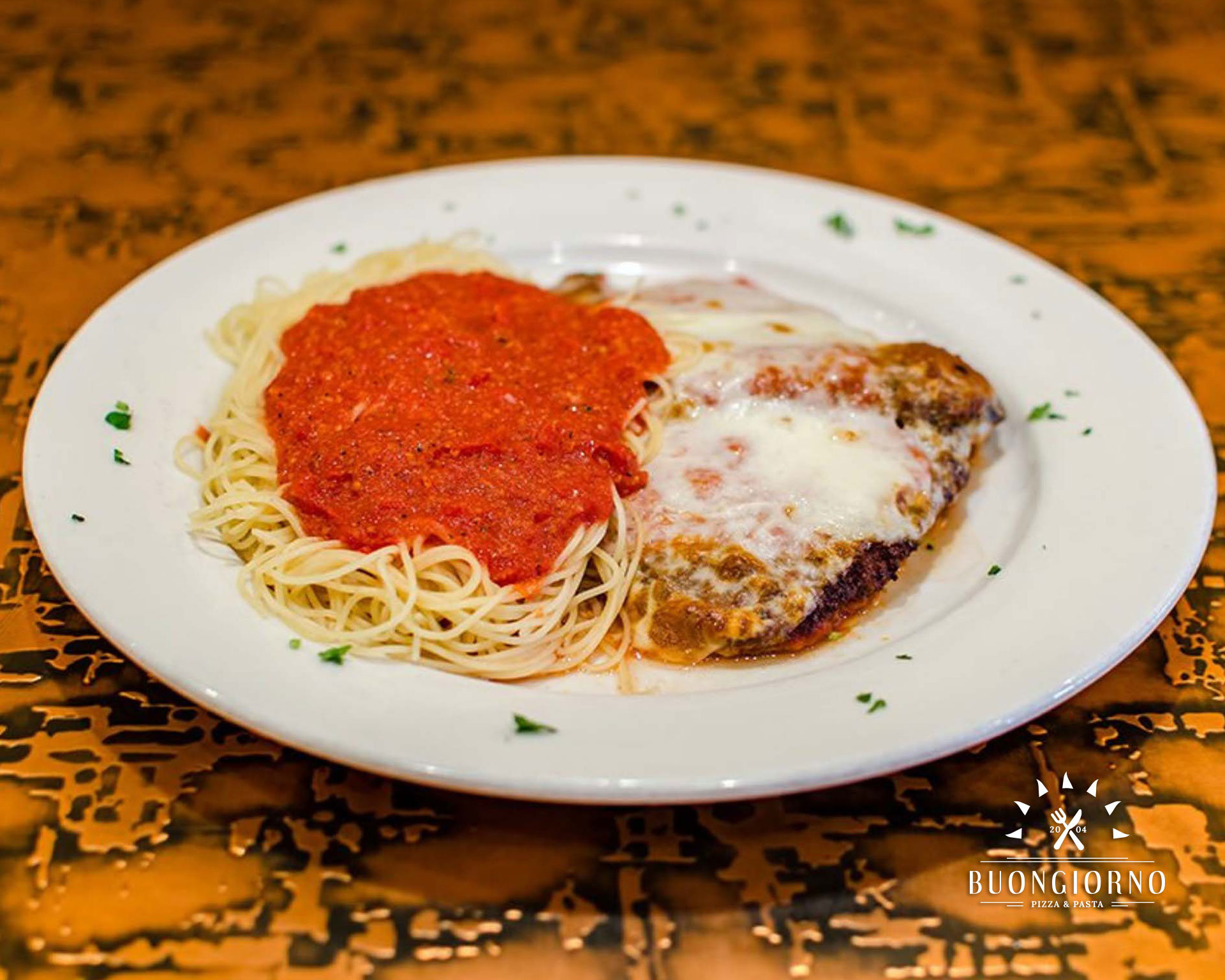 A plate of food with a white plate and red sauce.