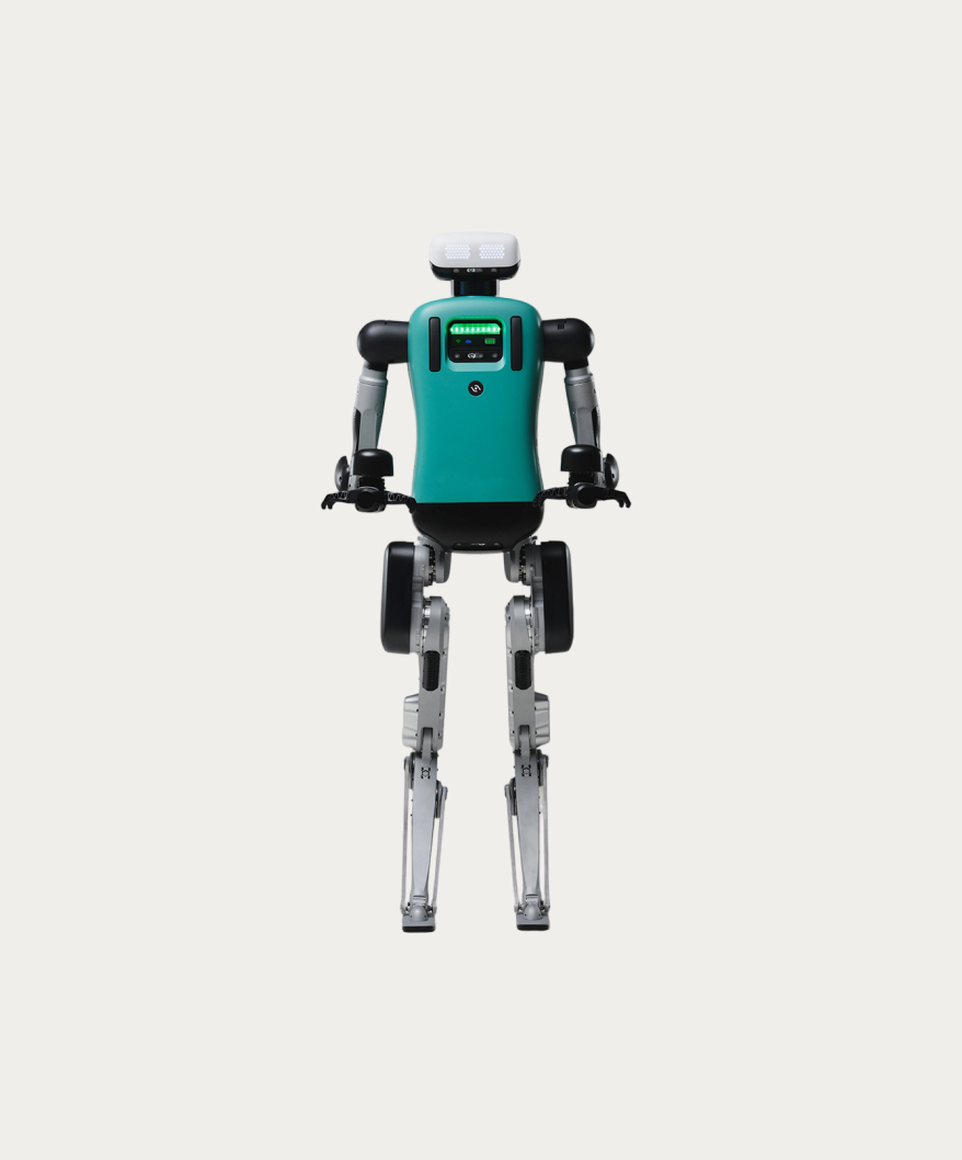 Humanoid robot with a teal torso, silver mechanical legs, and a white head displaying pixelated eyes.