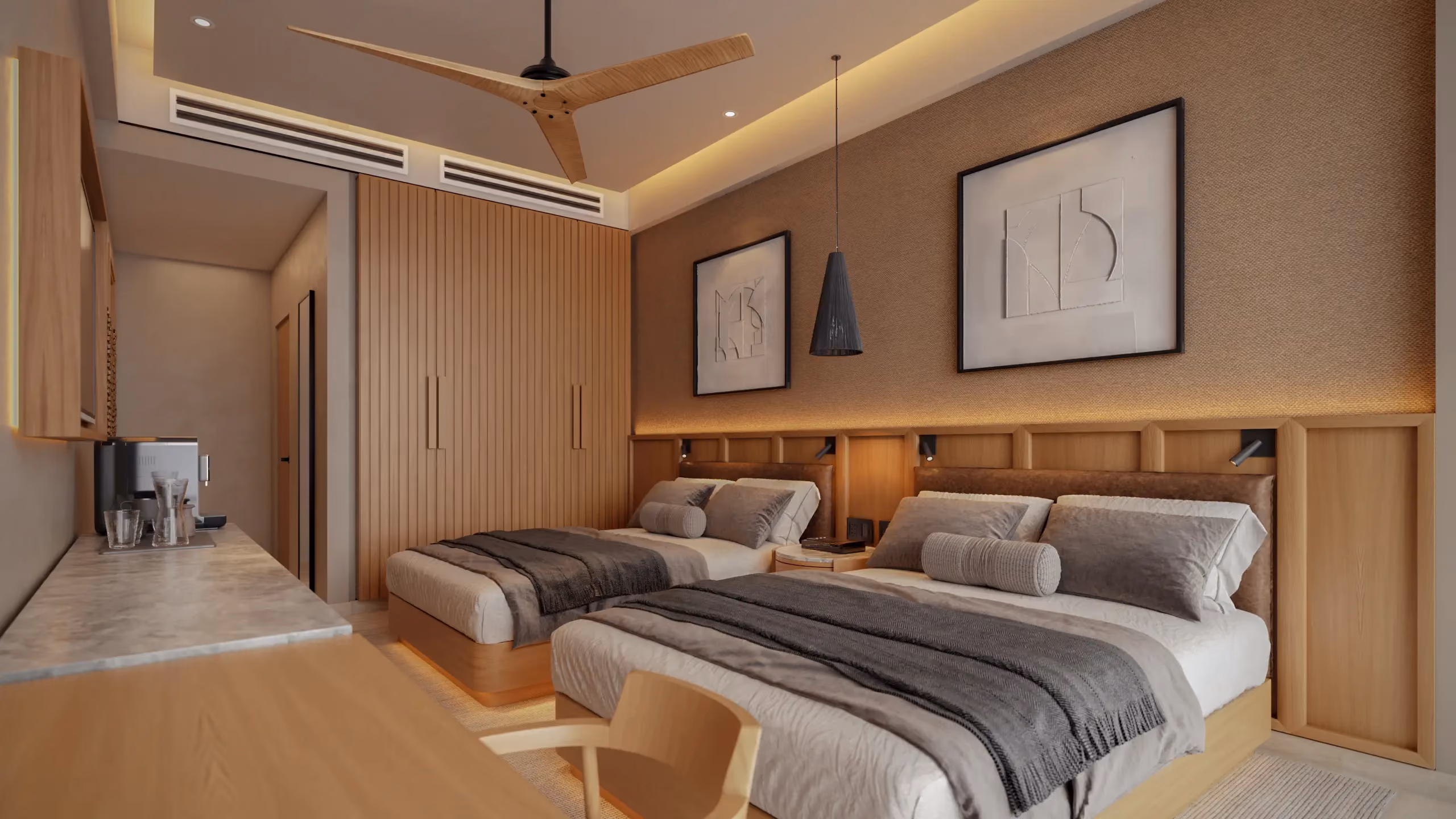 Modern hotel room featuring two queen beds with gray throws and bolster pillows, wooden headboards, a wooden desk with a chair, pendant light, abstract artwork above beds, recessed ceiling lighting, and a ceiling fan with wooden blades.