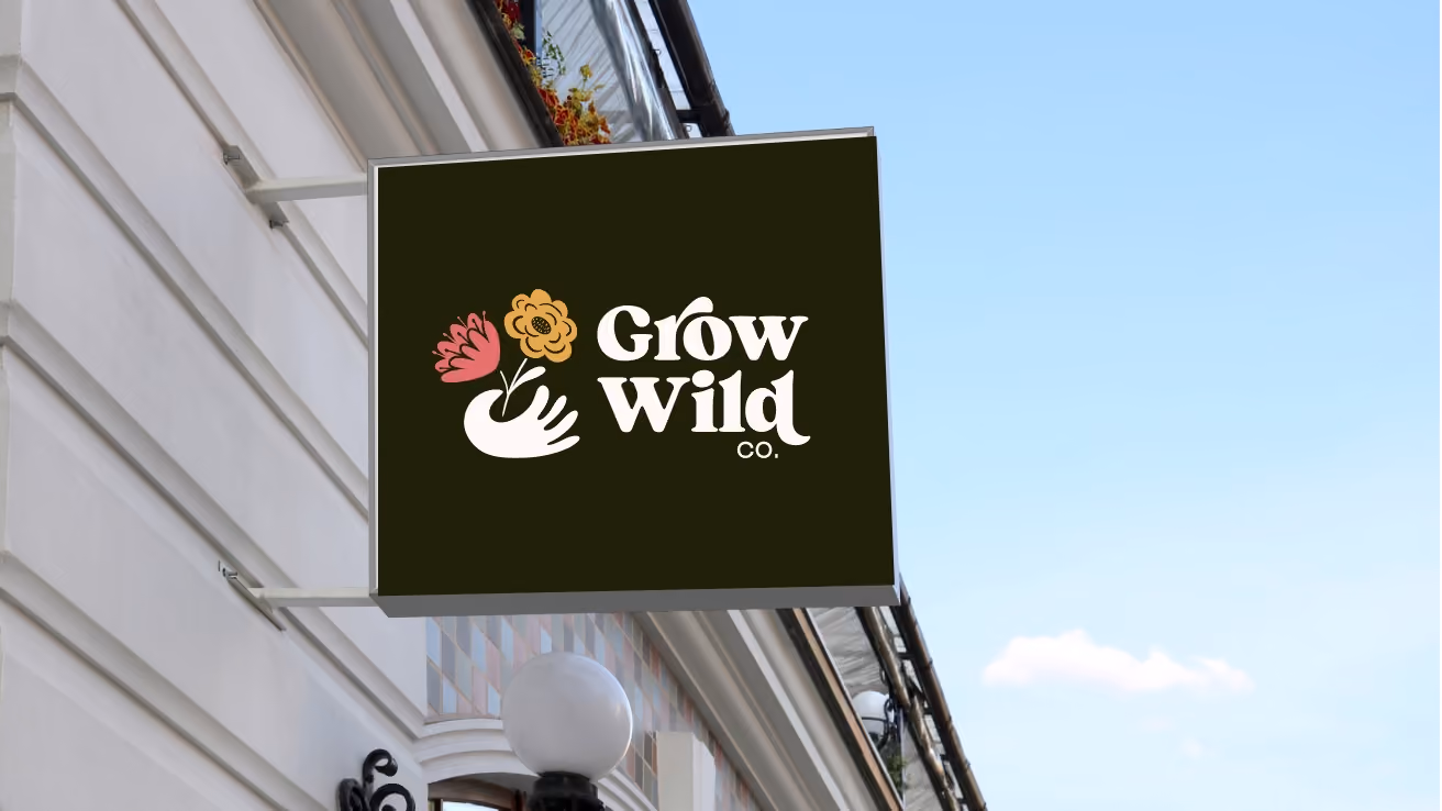 Grow Wild Co. blade sign mounted on store-front exterior