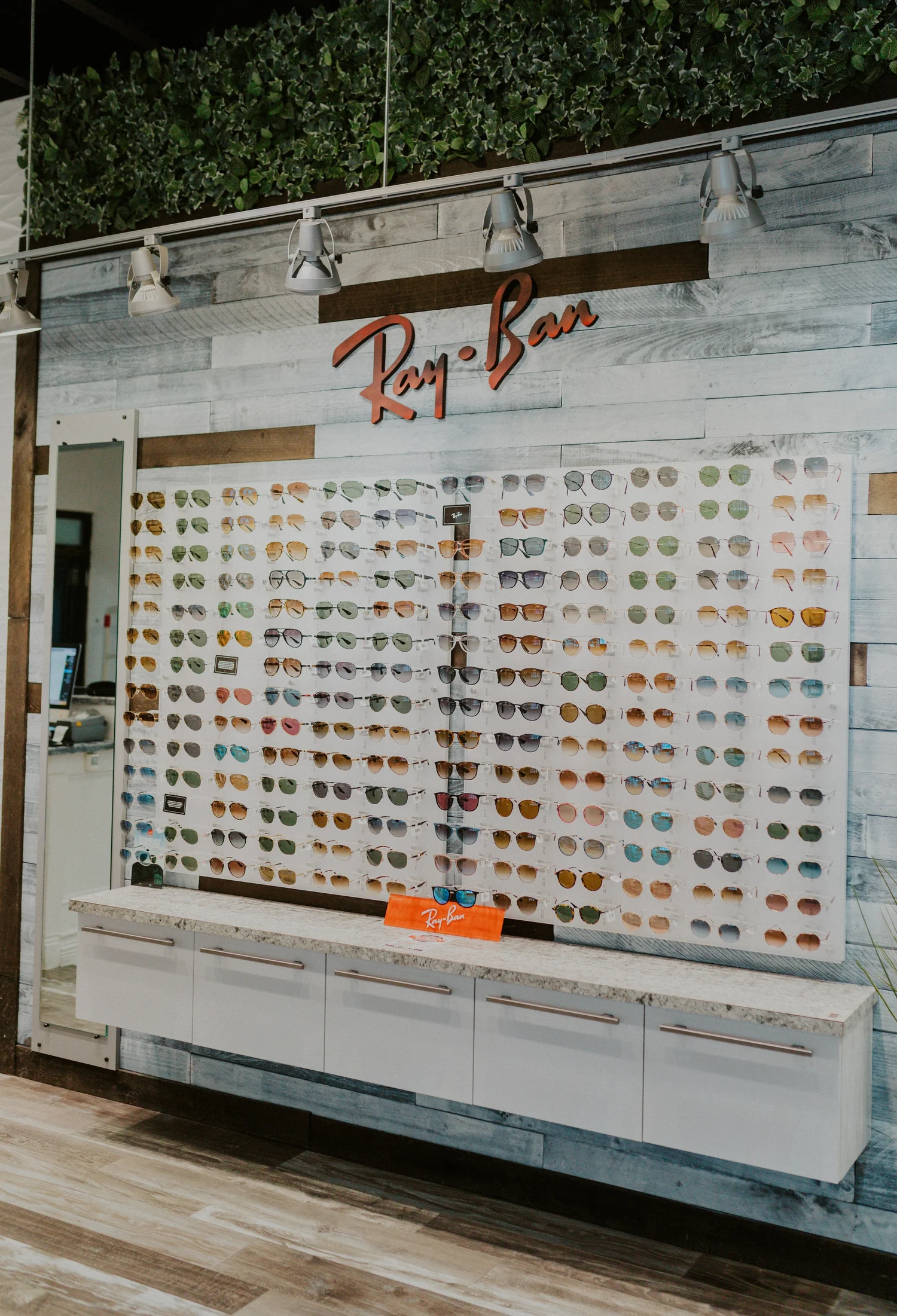 A rayban display case for ninety six shades collection of sunglasses