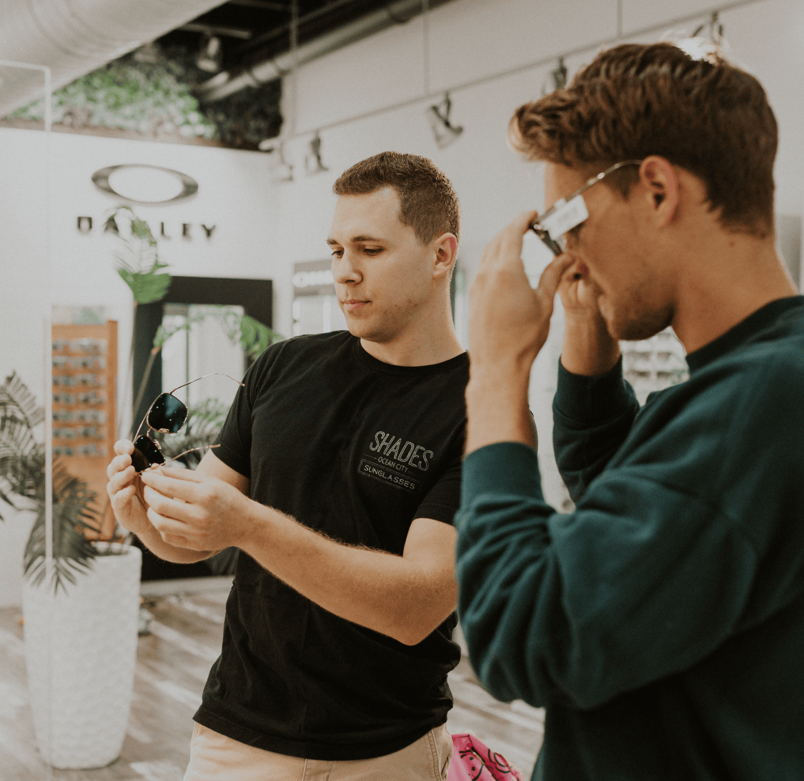 In store team members helping customers find a perfect pair of sunglasses