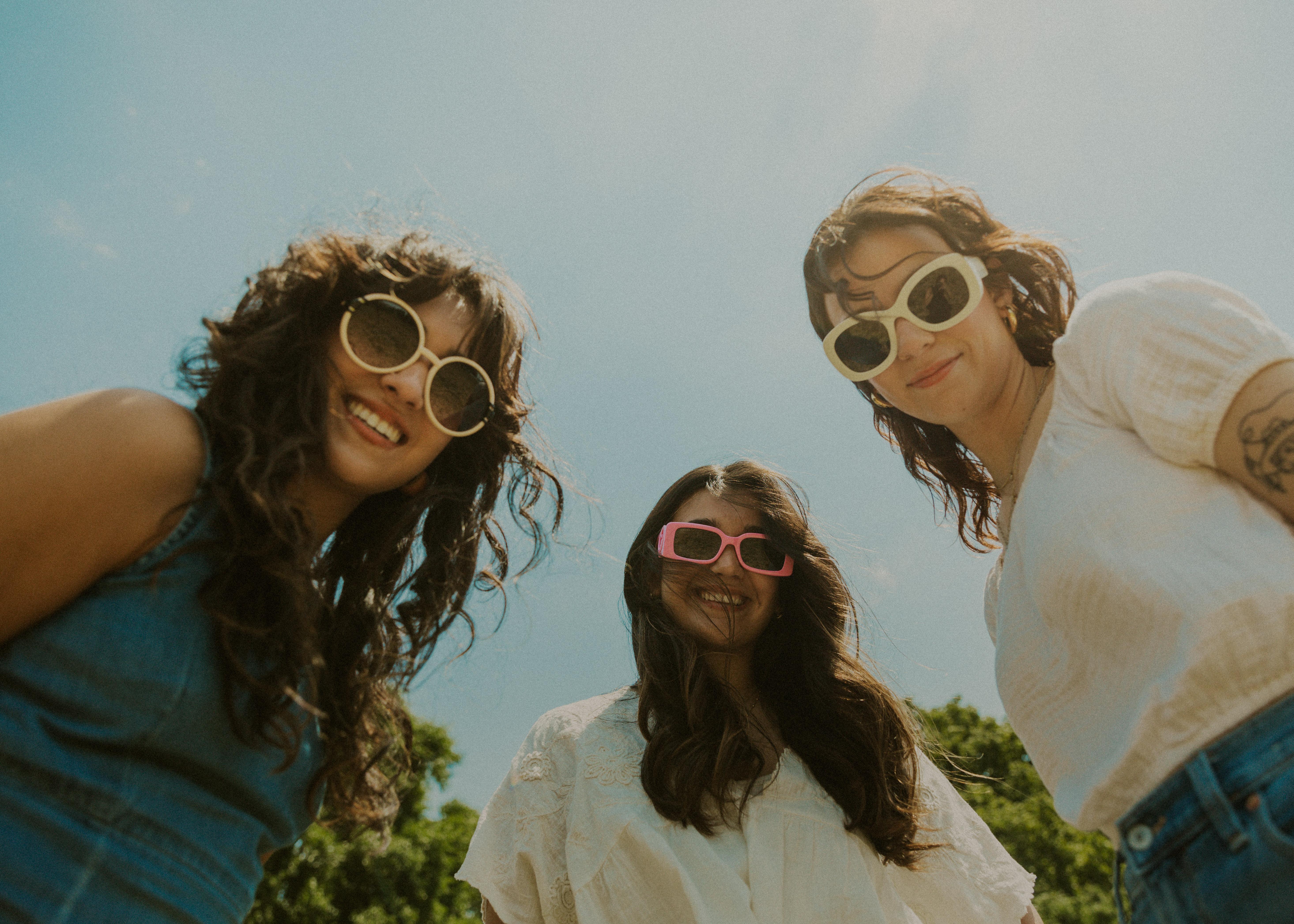 Marketing team observing a successful on-site sunglass gifting activation at a branded corporate event