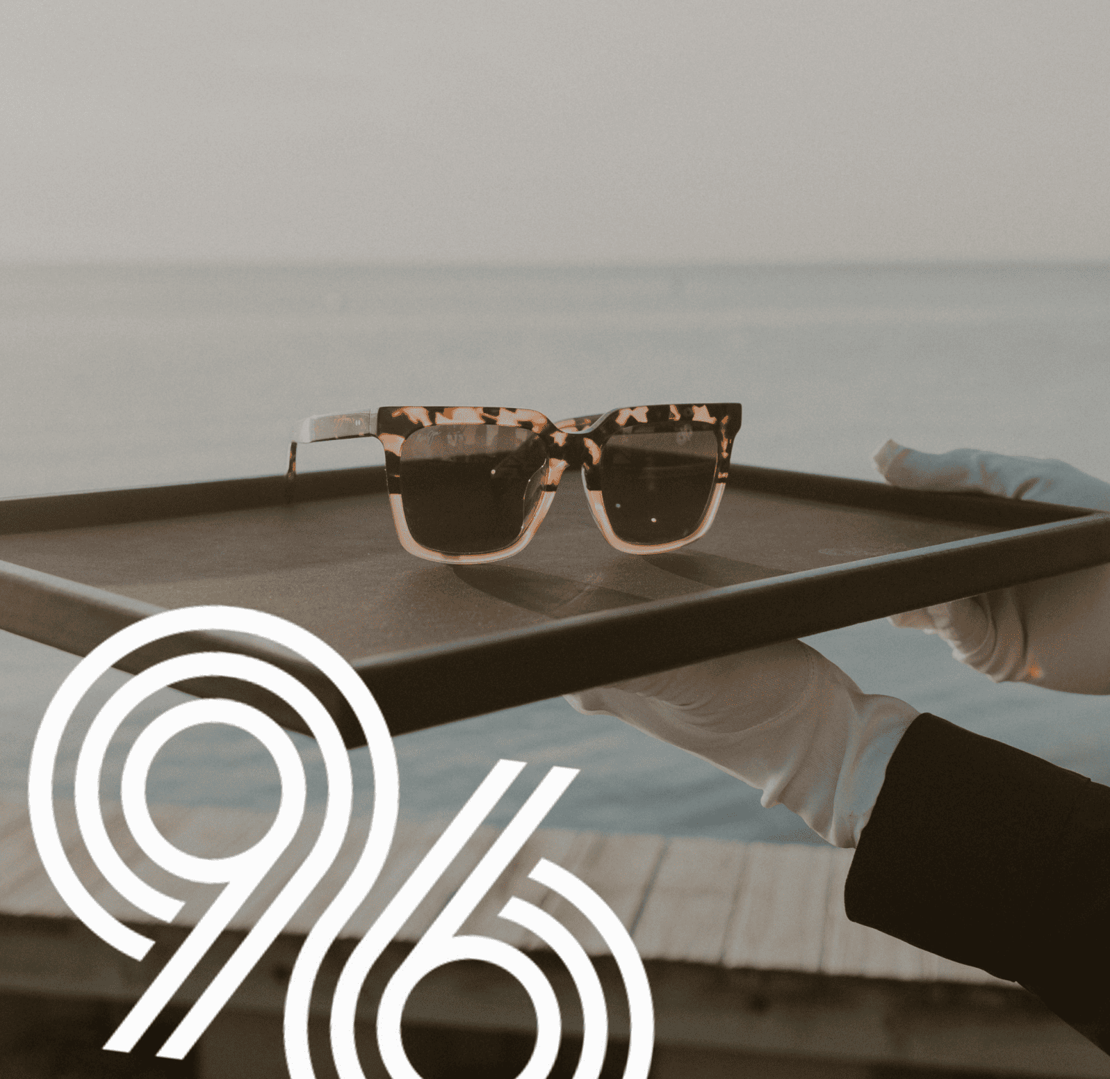 Guests browsing a curated sunglass display at a corporate event on-site gifting activation