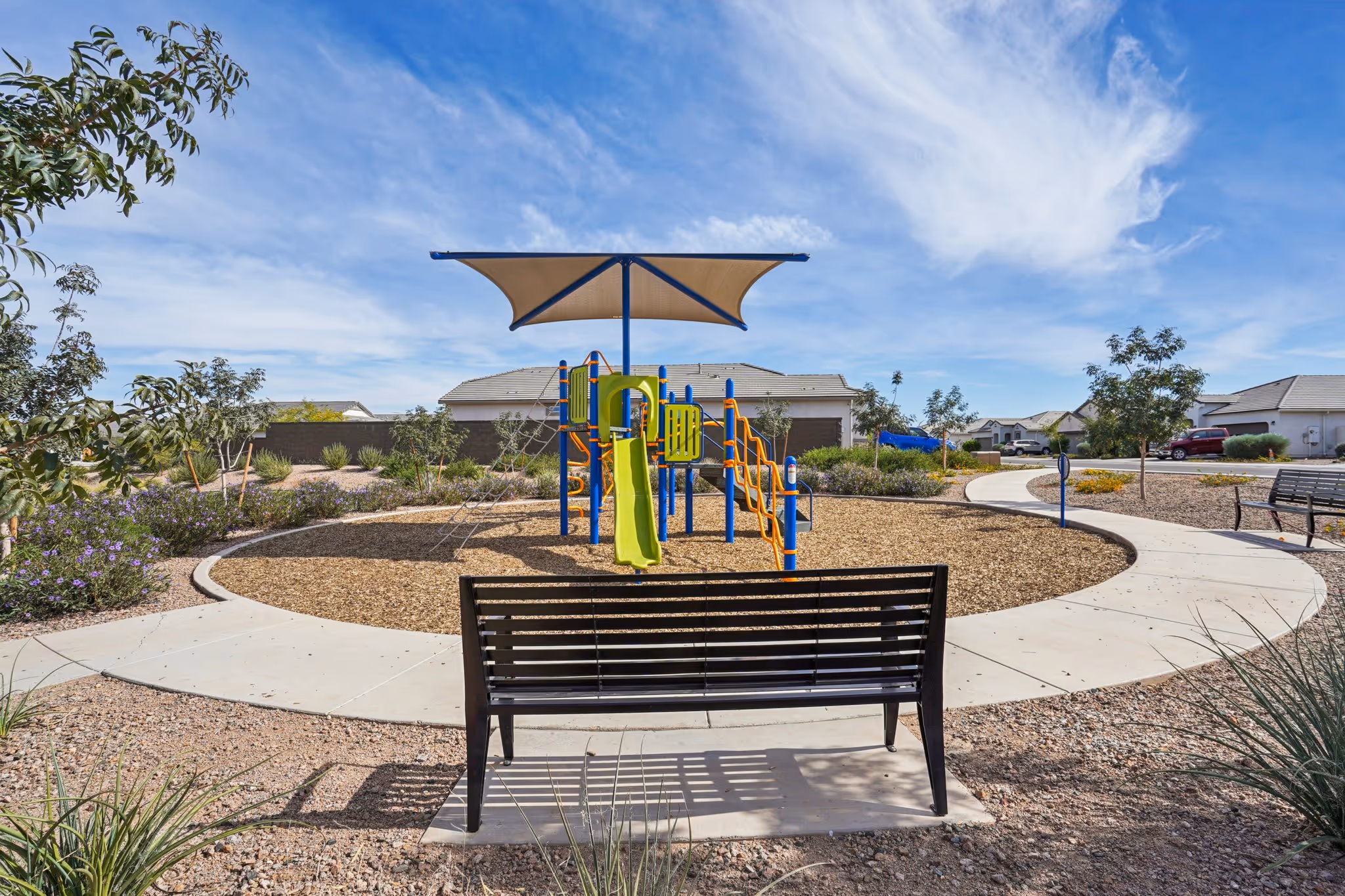 Outdoor park with benches and sidewalk