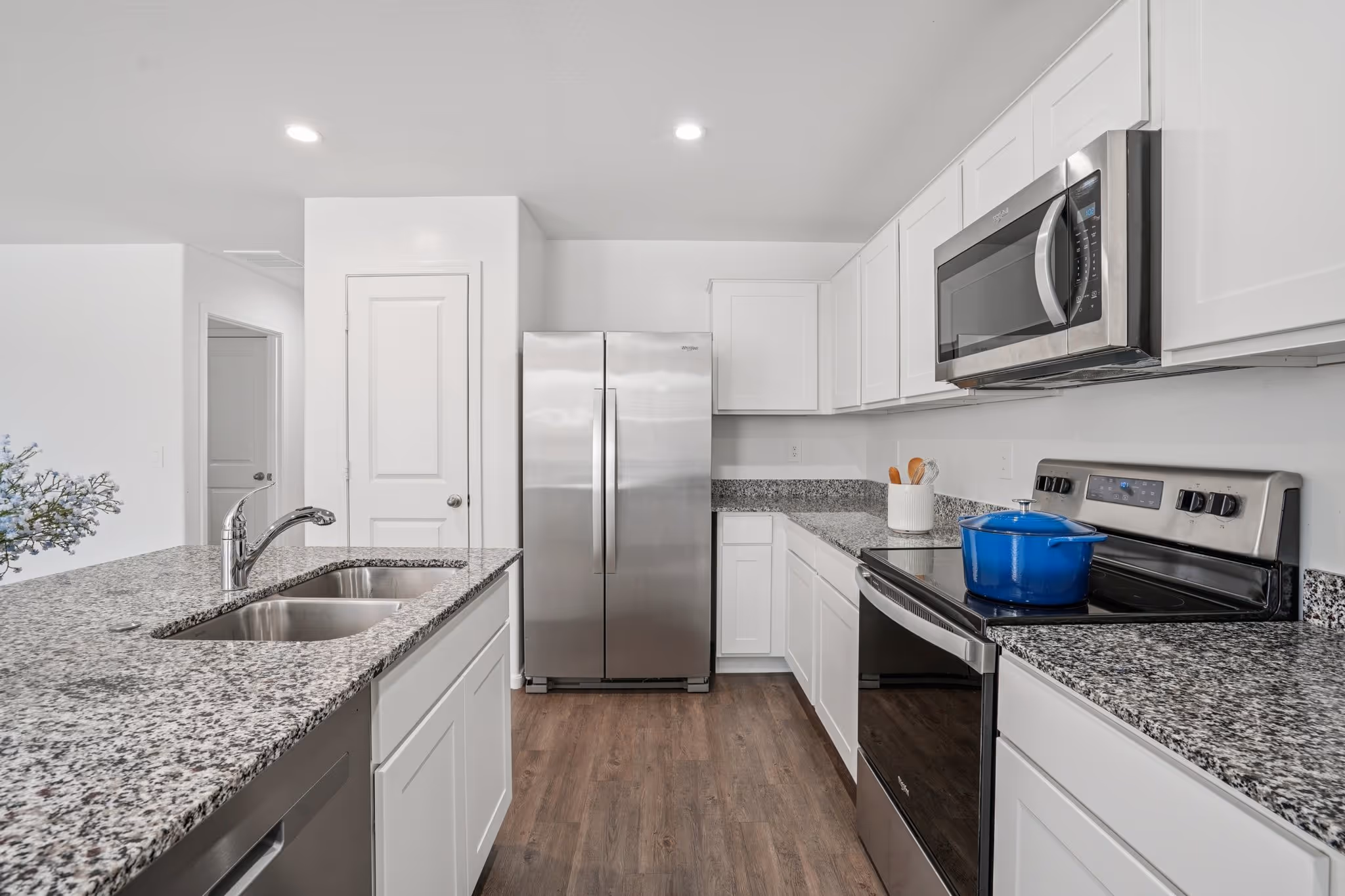 Kitchen with white cabinets and stainless steel appliances