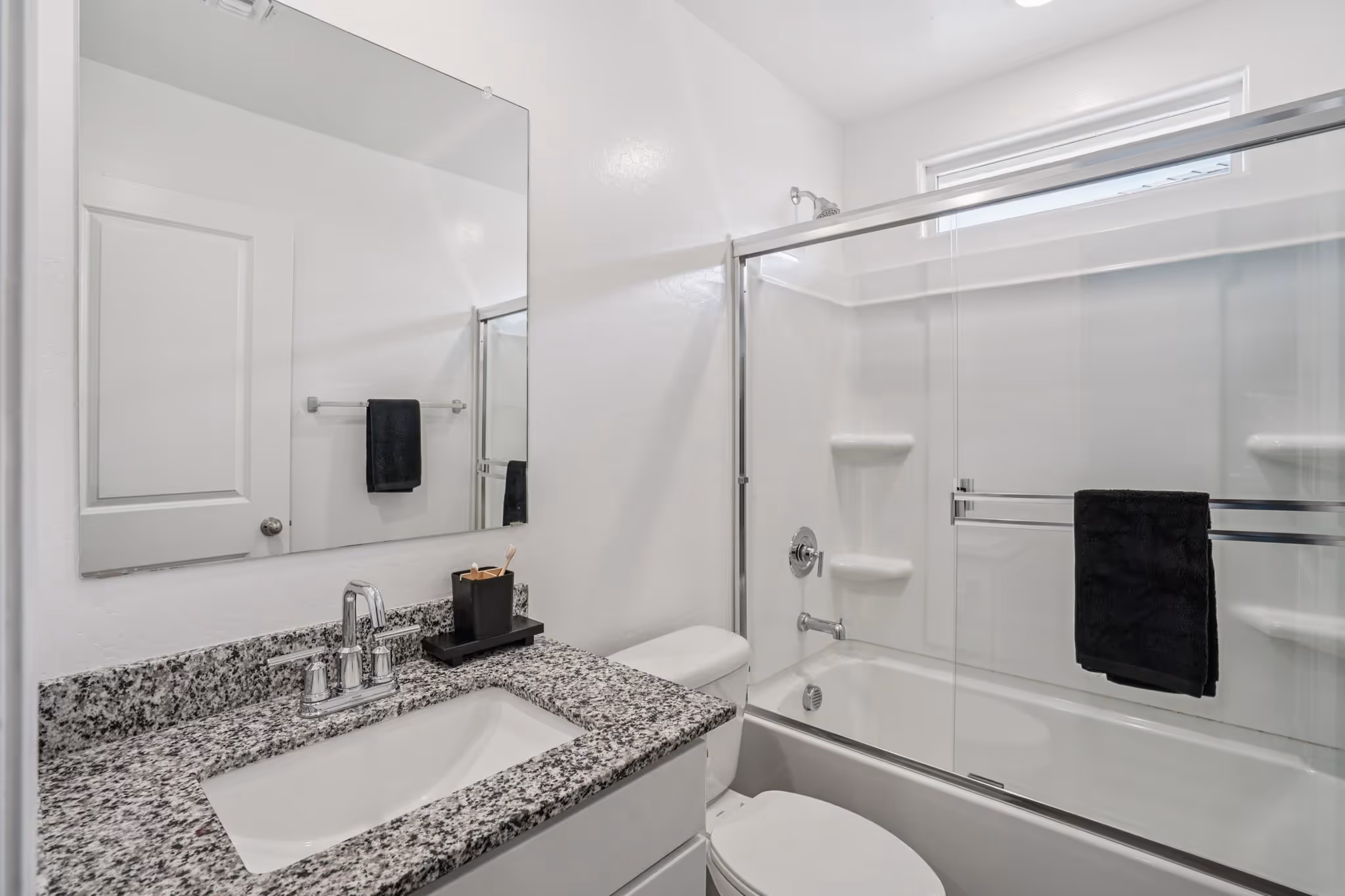 Bathroom with vanity and full shower and bathtub
