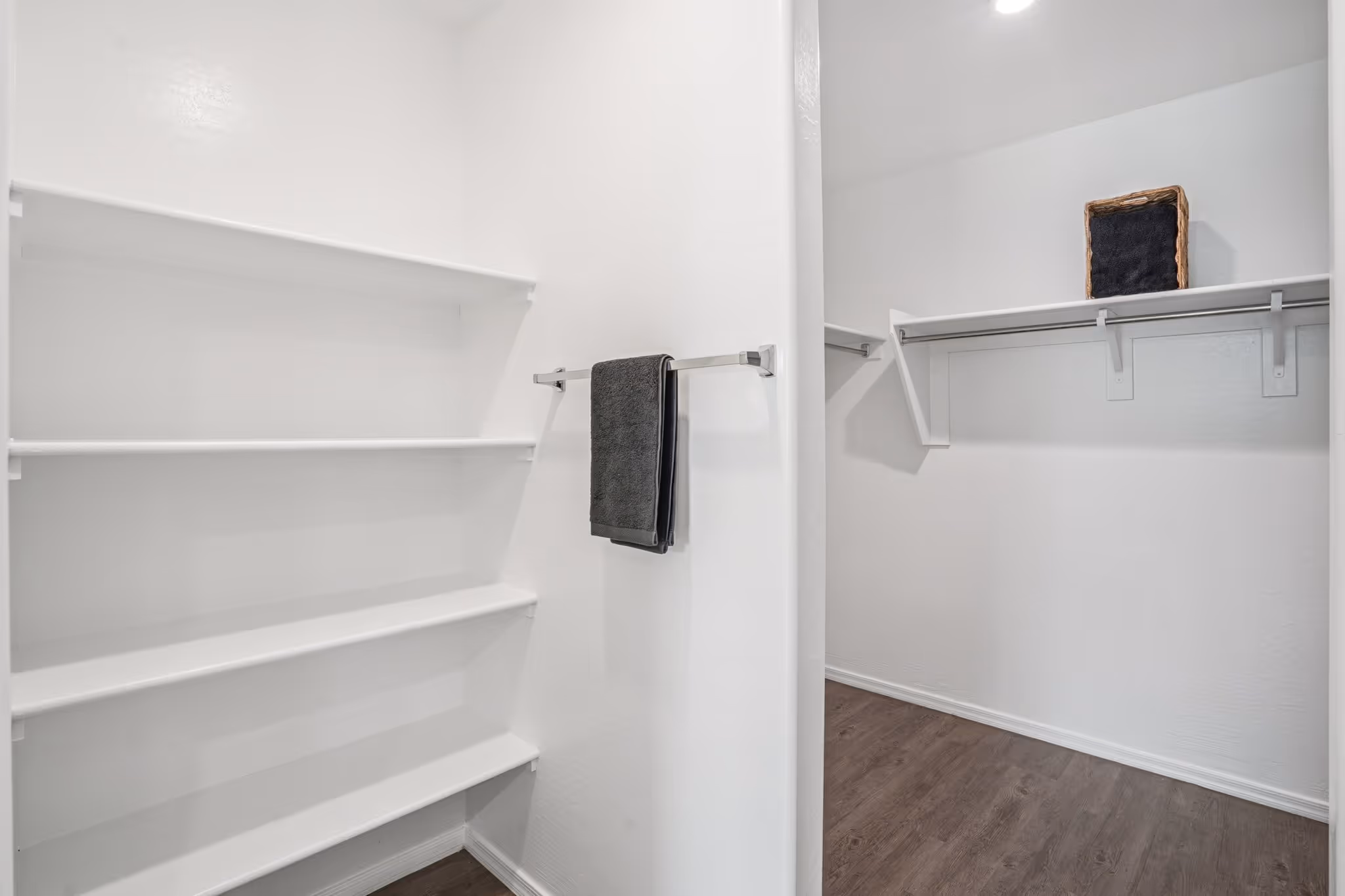 Closet with shelving and clothing rack