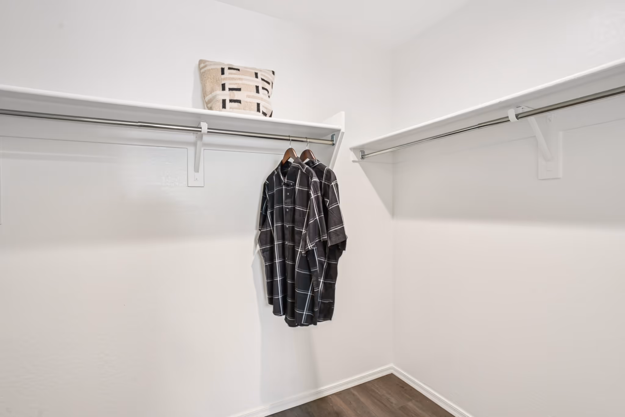 Closet with two shirts hanging