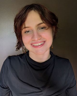 Headshot of Tabitha Cook, LPC-Associate, a therapist specializing in trauma and anxiety.