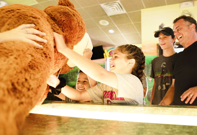 Girl winning an arcade prize