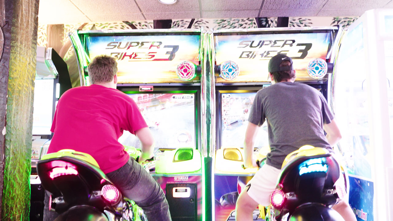 2 friends at the arcade