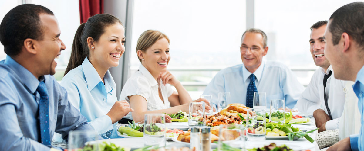 Group of people eating food out of the office