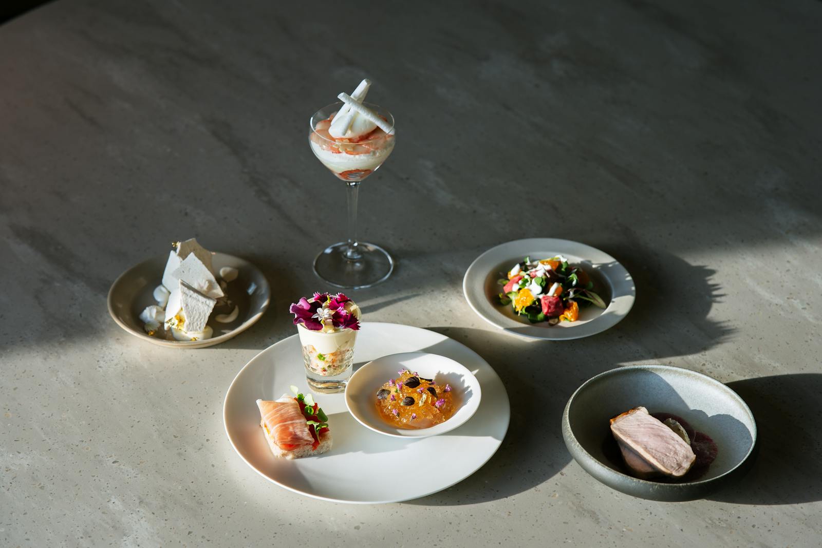 Elegant fine-dining plated gourmet dishes on a restaurant table