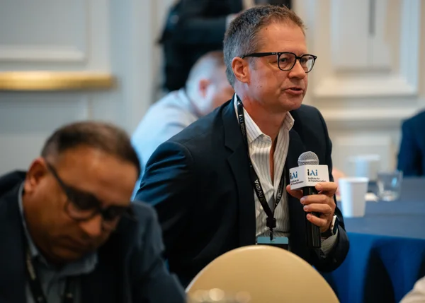 An attendee asks a question during the Dallas summit