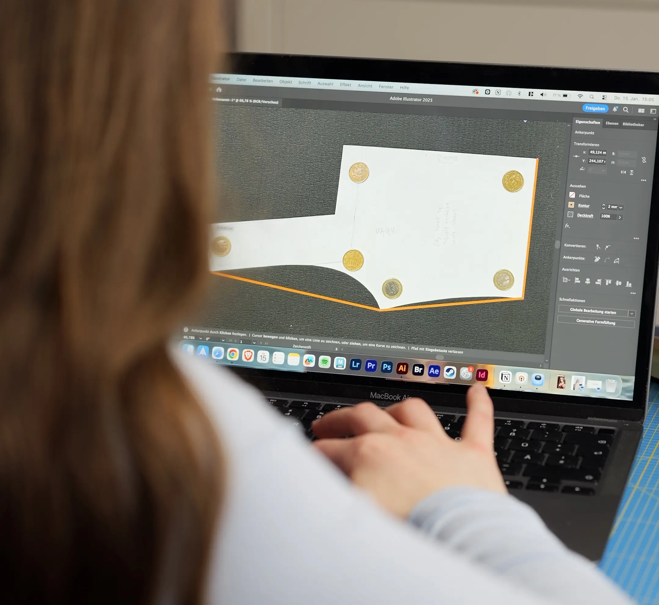 Maren tracing a pattern in Illustrator by hand