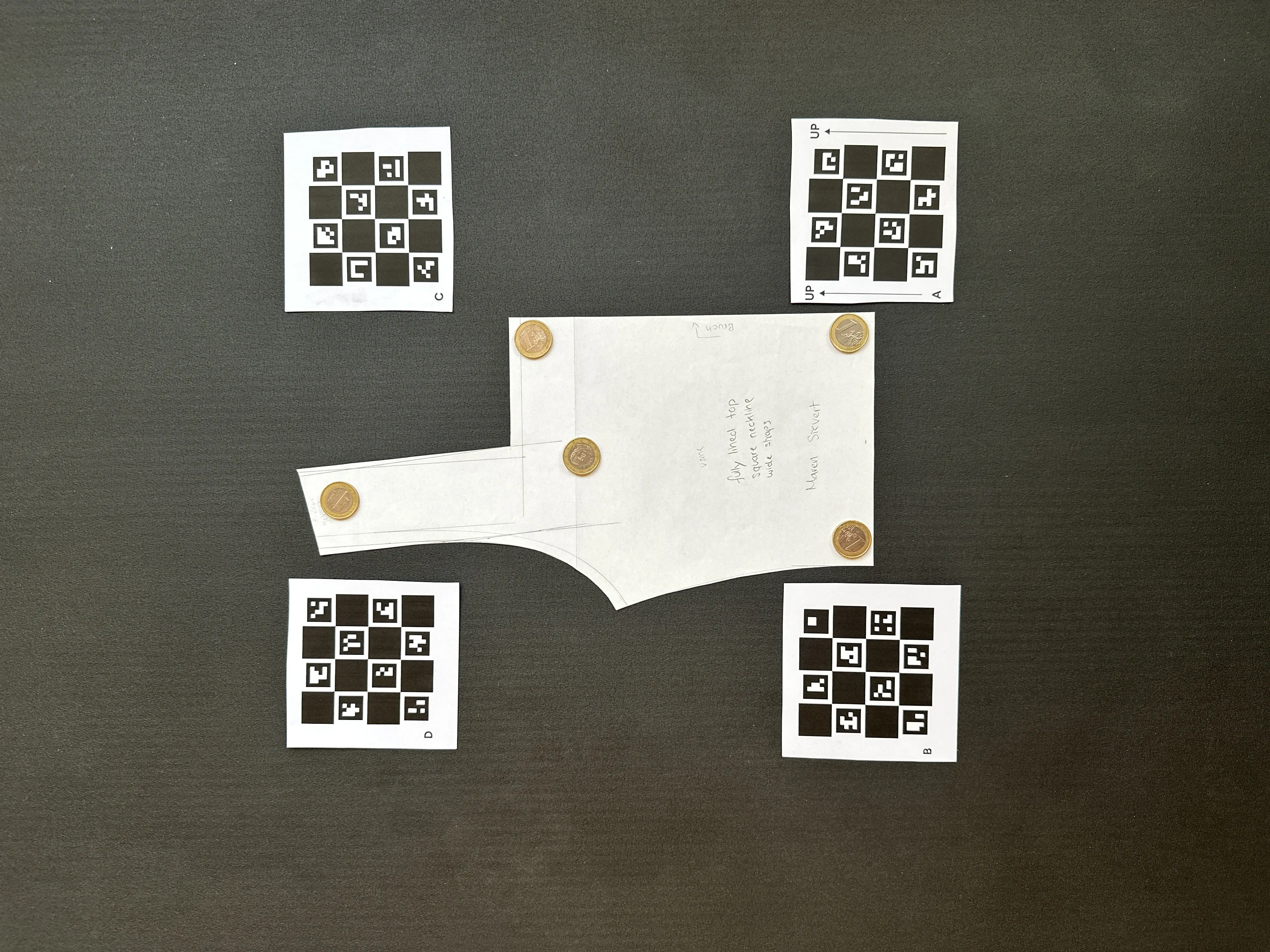 Pattern piece with the four Reference Tiles and coins as weights