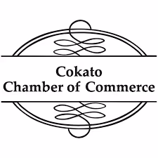 Black and white logo of Cokato Chamber of Commerce with ornamental curved lines framing the text.