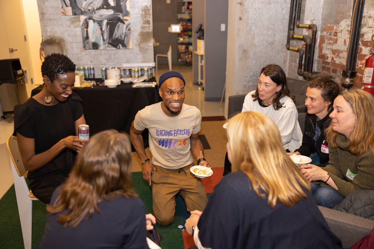 Corn kneeling with a group.