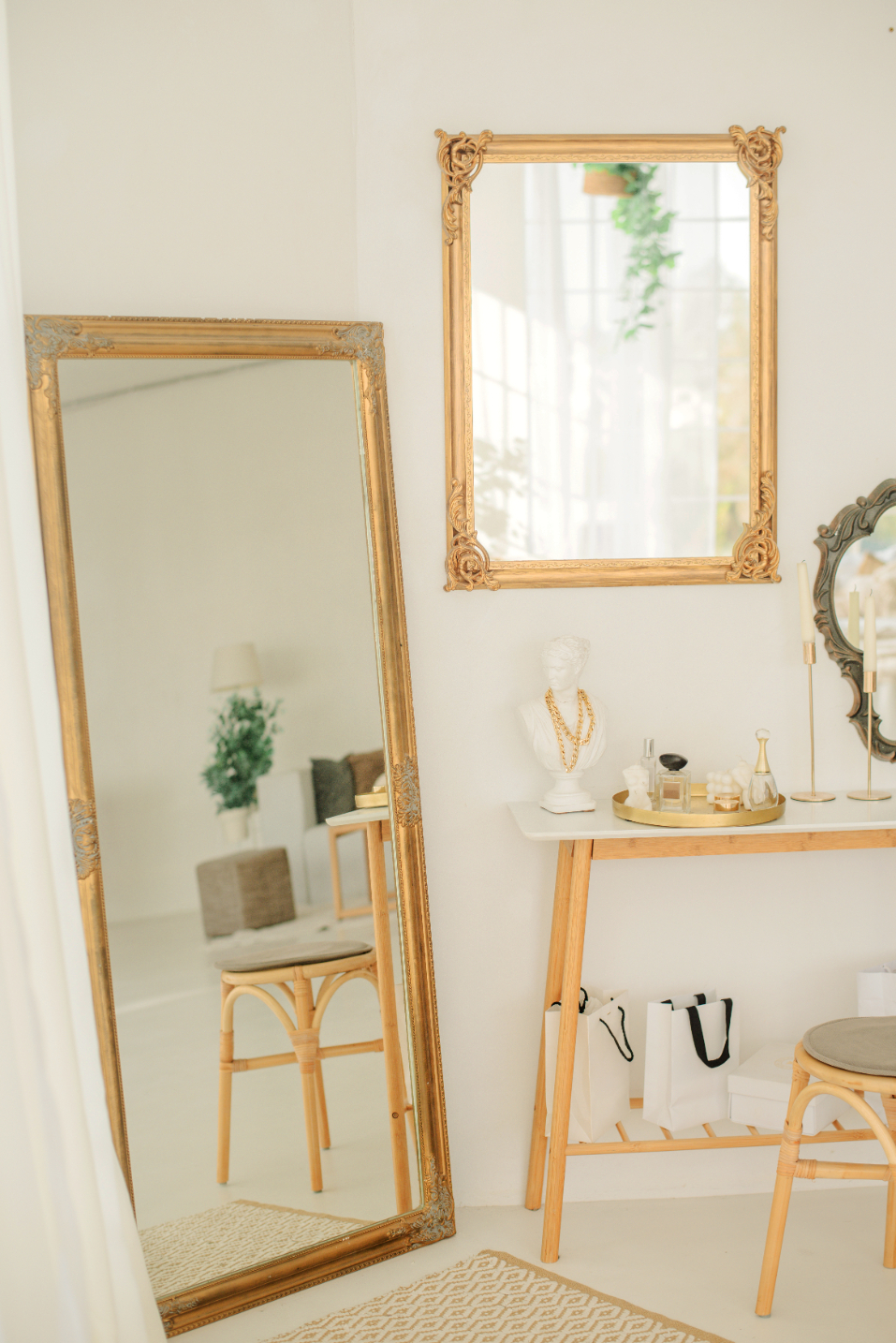 Mirrors on wall and decorated table stock image