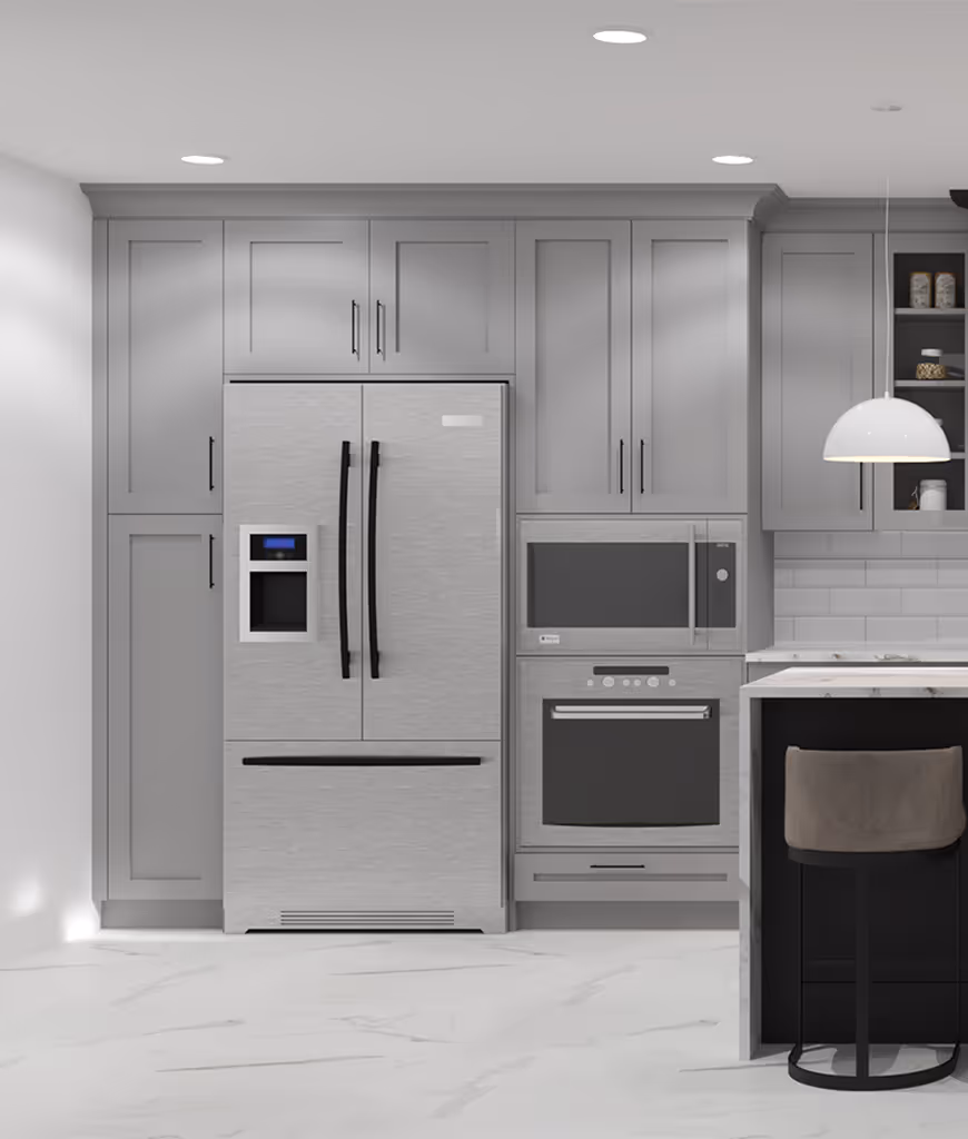 A kitchen with a refrigerator, oven, and stove.