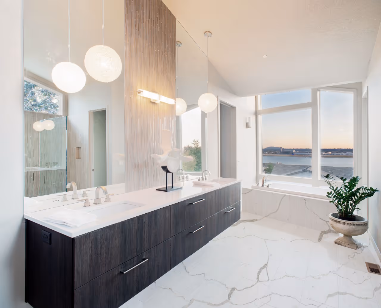 Bathroom with marble countertop and with cabinets vanity