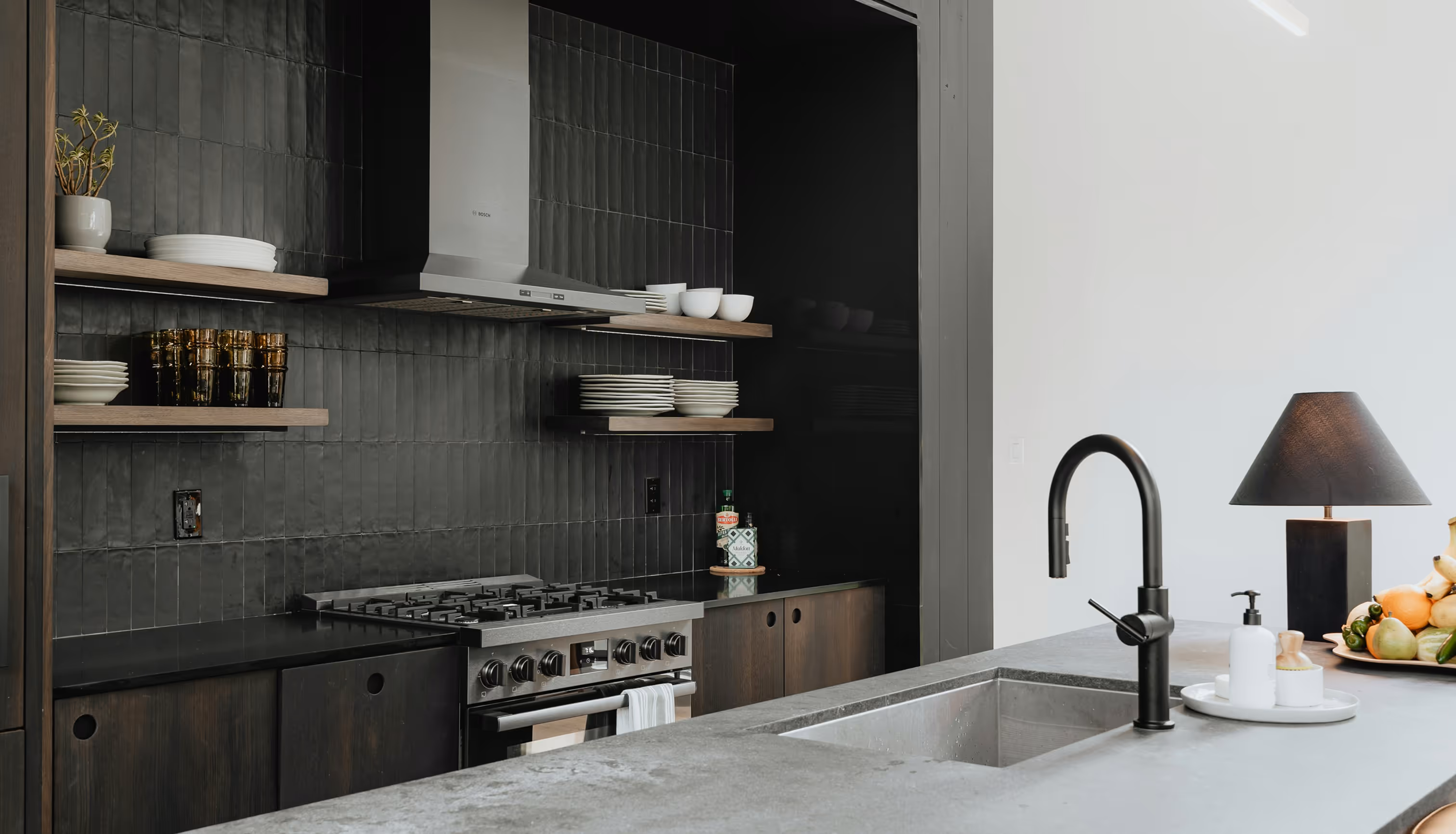A kitchen with a stove and a sink.