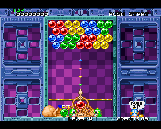 Colorful bubble shooter game screen with red, blue, green, and yellow bubbles arranged at the top and a shooter aiming bubbles at them.
