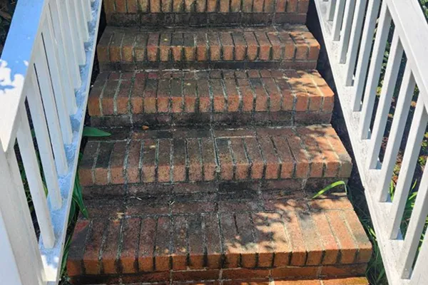 Stairs that are dirty prior to receiving pressure washing services