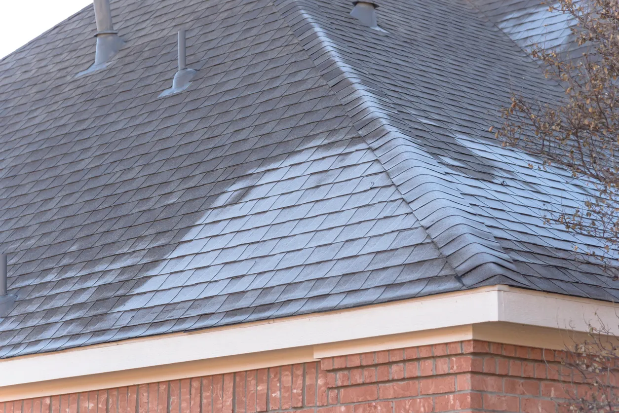 A roof that is being cleaned by power washing