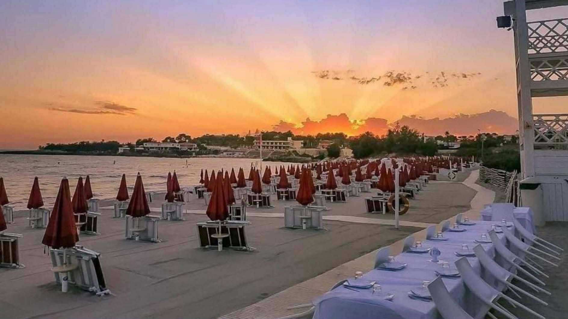Experience a breathtaking sunset over Taranto beach in Puglia, Italy
