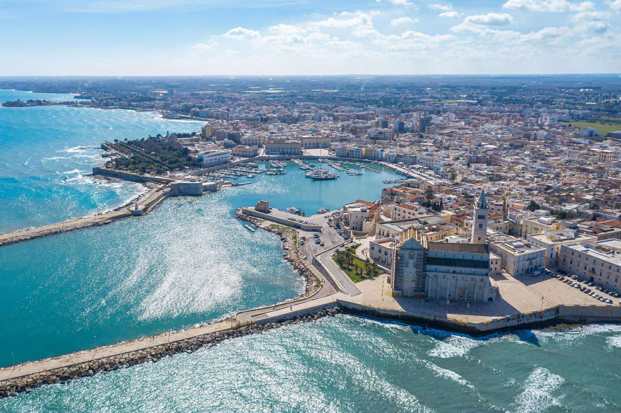 Trani, Puglia, with its vibrant harbor, historic architecture, and sparkling Adriatic Sea