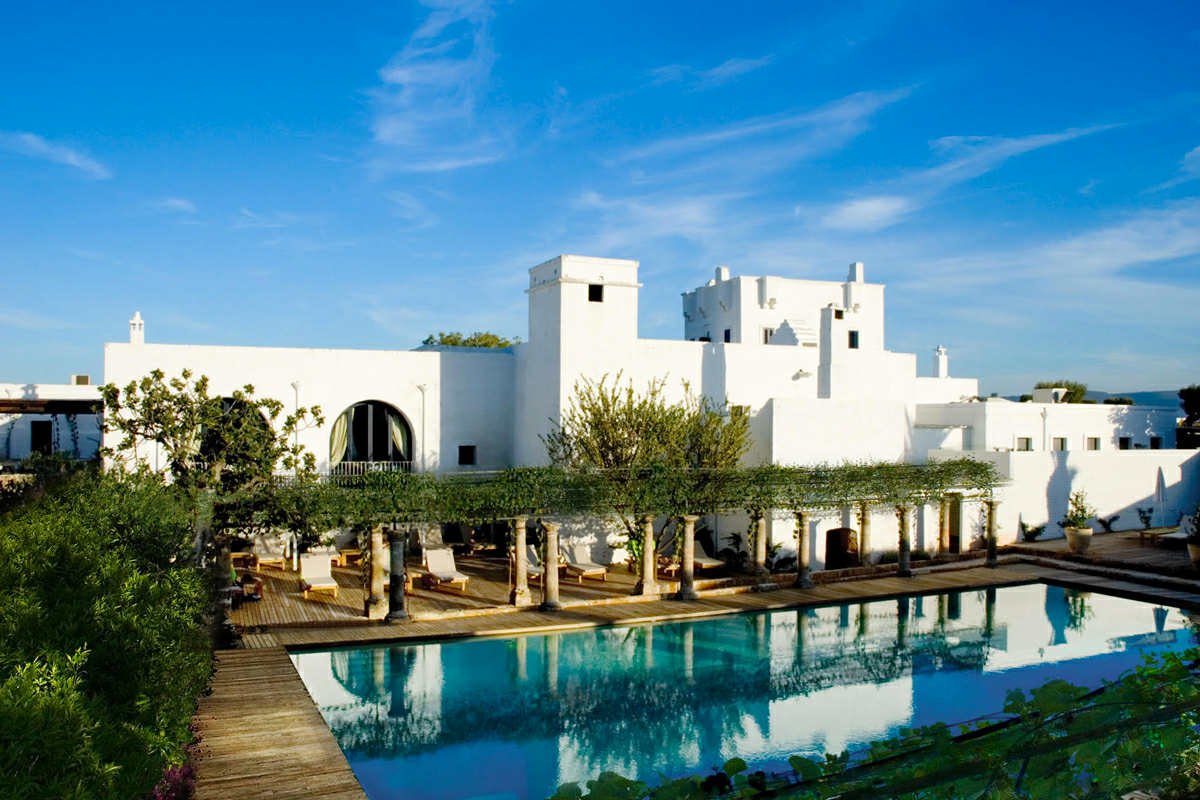 An Apulian masseria is a traditional stone farmhouse surrounded by olive groves, offering authentic charm, luxury stays, and a taste of Puglia’s rural heritage.