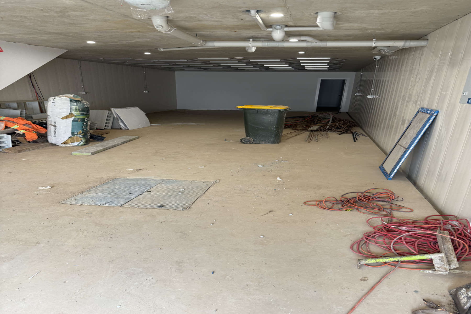 Basement concrete floor during preparation for the Merrylands duplex epoxy flake system