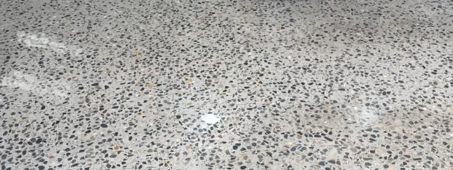 Completed 3000 grit mechanically polished concrete floor matched to the existing high-gloss finish