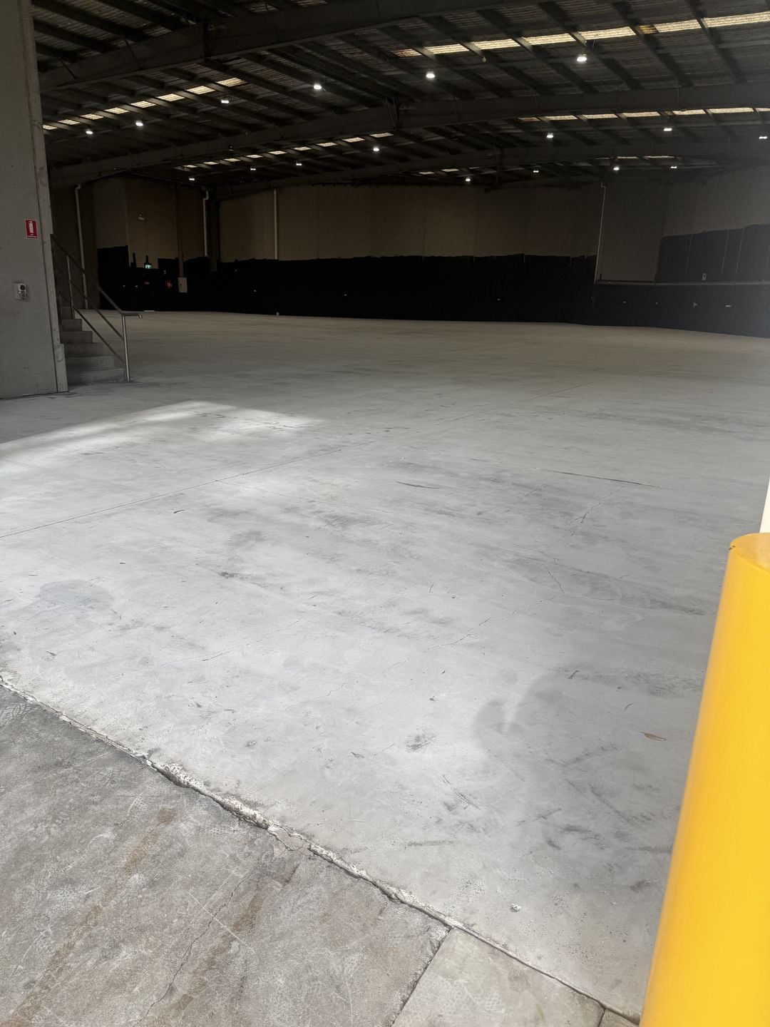 Prepared Campbelltown warehouse slab after large-area concrete grinding