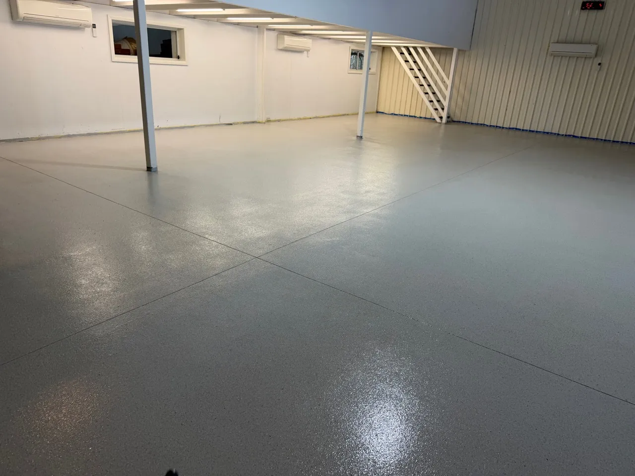 Flooring across the main hall and beneath the mezzanine.