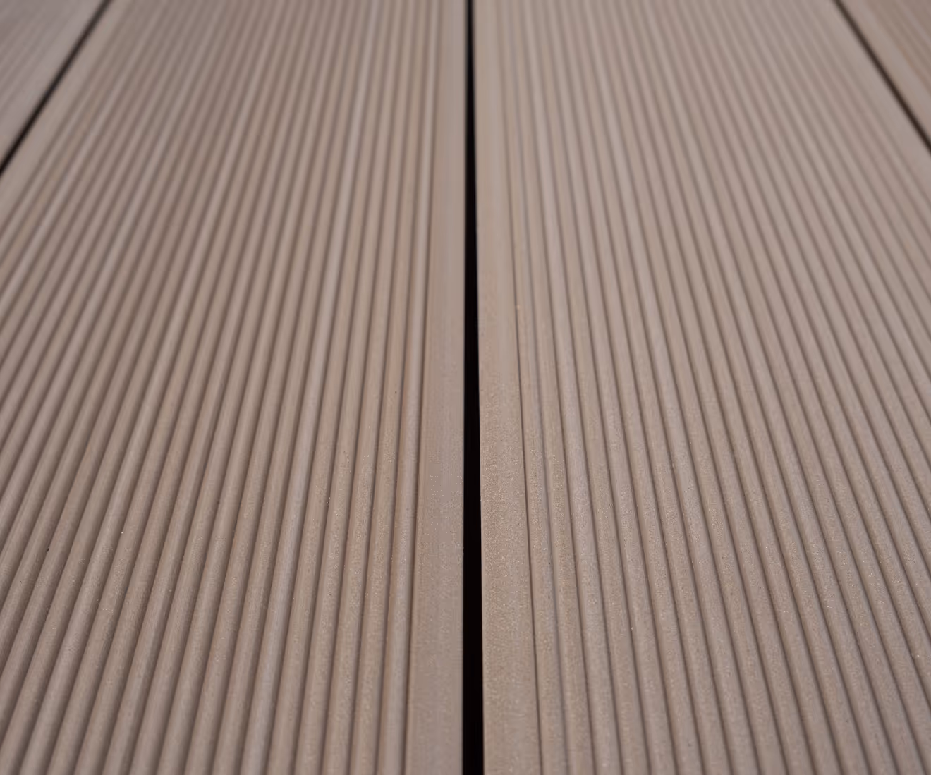 Close-up of a Tarimatec composite decking board surface