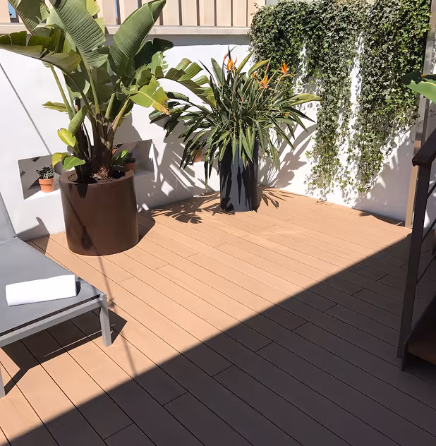A clean modern Tarimatec composite deck terrace with furniture