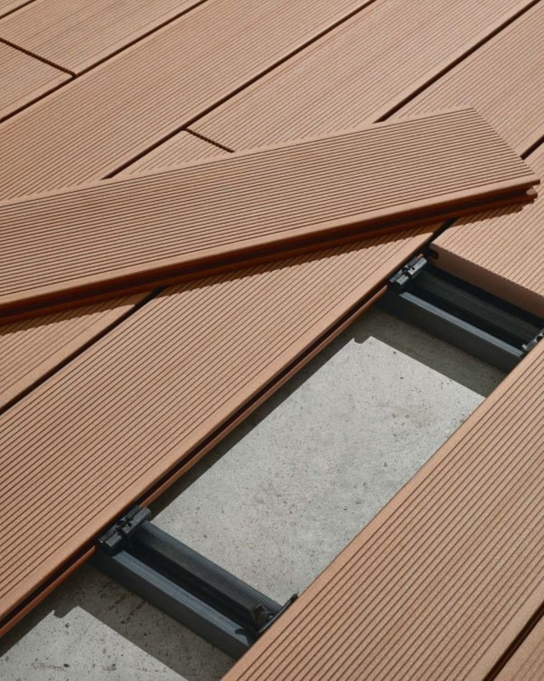 Spacing being set between Tarimatec deck boards during installation